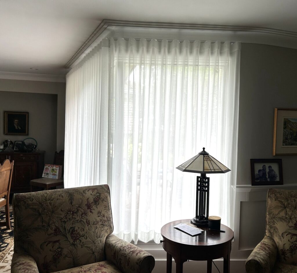 Corner windows with sheer drapery